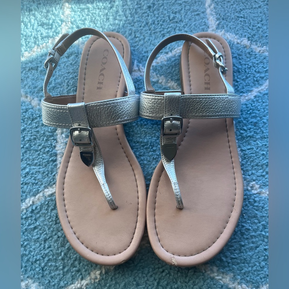 Coach Woman’s pebbled Metallic Silver leather T-Strap Sandals